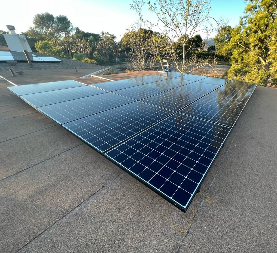 High-efficiency solar panel installation on a low-slope roof near Point Dume in Malibu, CA