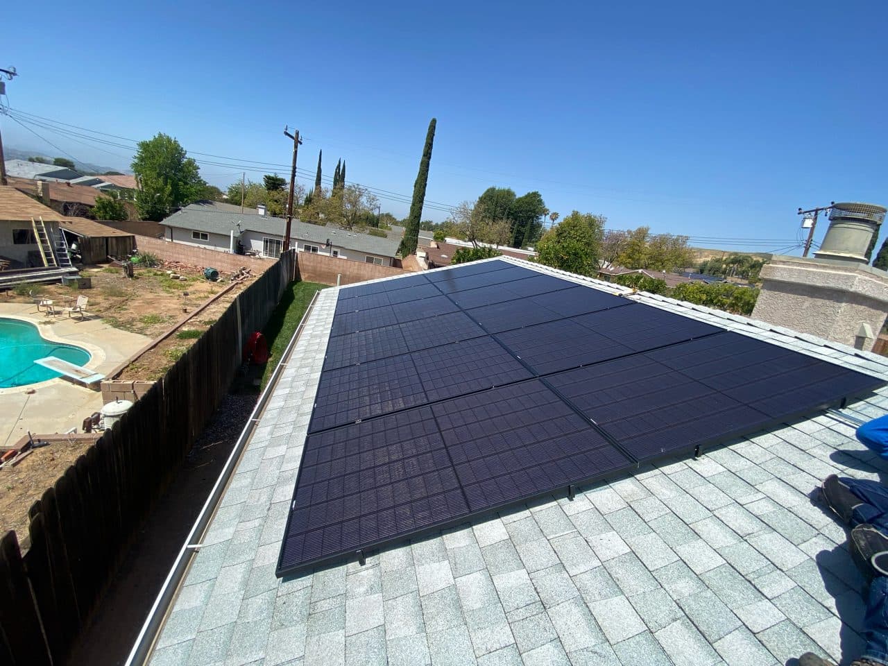 All-black solar panel installation on a composition shingle roof in Simi Valley, CA by Helios Energy Global